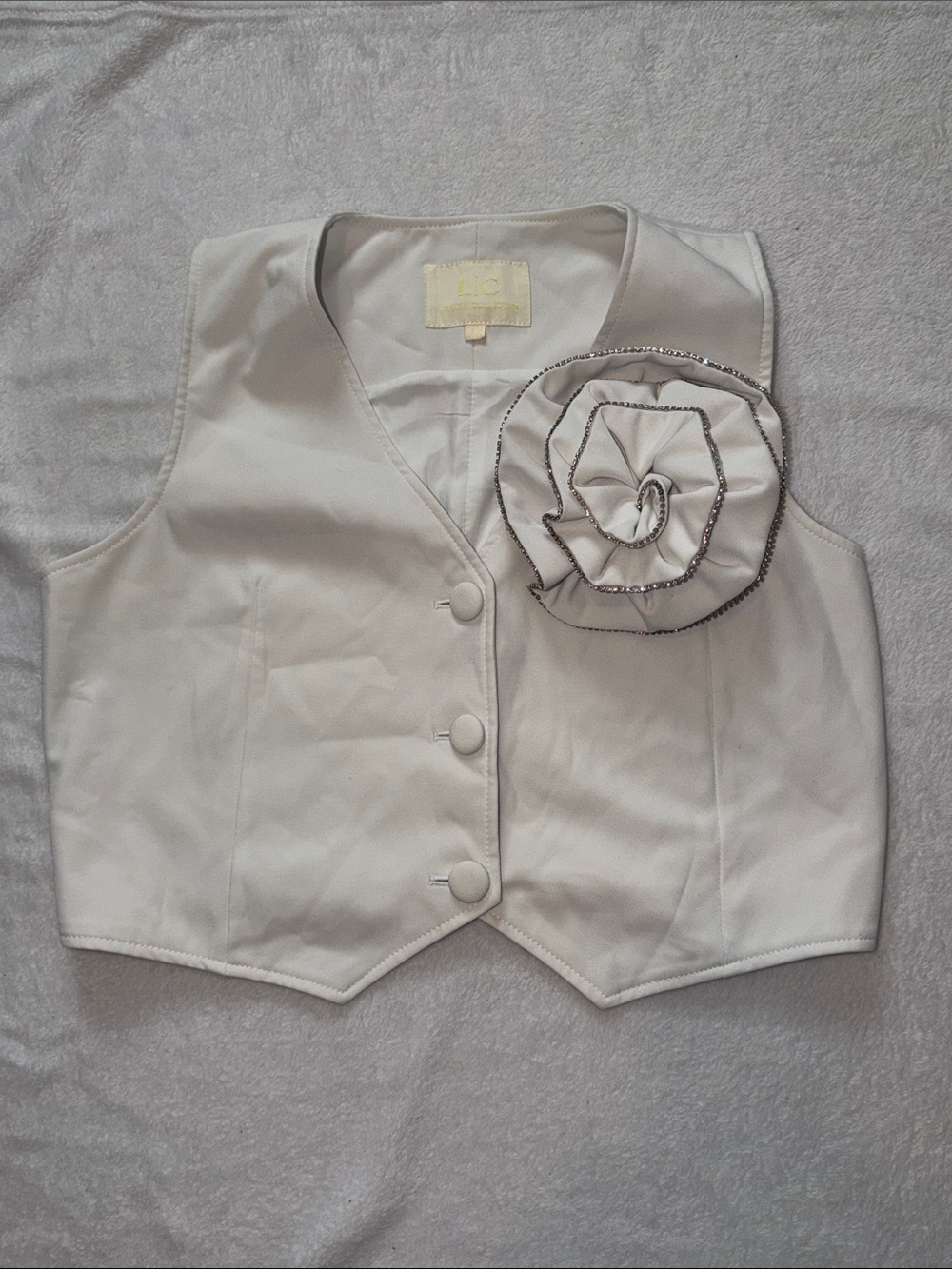 Elegant Cream Women's Vest with Decorative Rosette